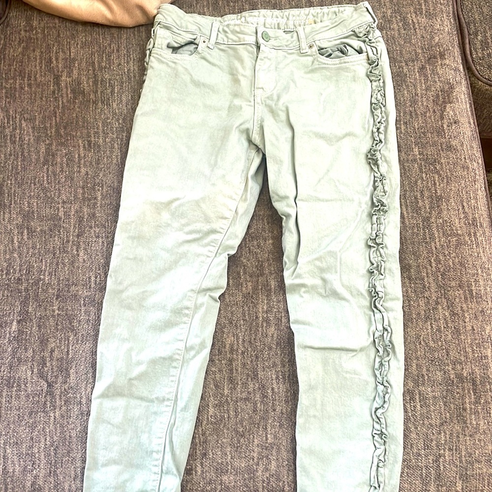 Green jeans with little green bows on side. I4 for girls
